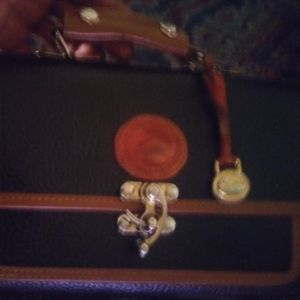 Dooney Bourke backed All Weather Leather